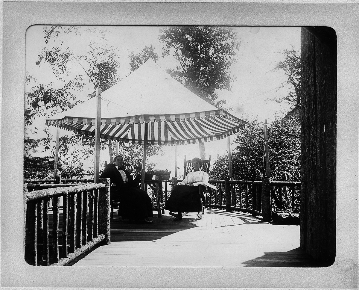 E. Alice AustenAlice Austen and GertrudeTate on Porch at TwilightRest, Catskills, NY 1899Collection of the Alice Austen House© E. Alice Austen